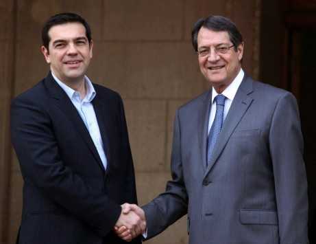 Anastasiades and Tsipras handshake